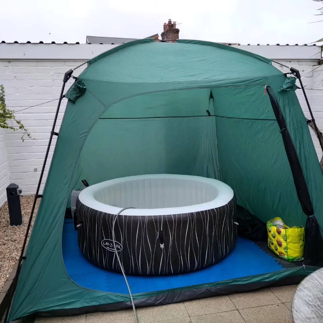 hot tub with green tent day time